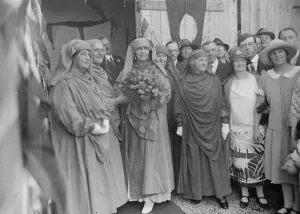 Robing of Mari Gwalia. Gorsedd Honour for Romania queen at Pwllheli. Left to