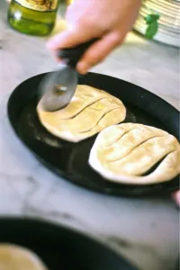 Kitchen Prints: Rolled out pizza dough with olive oil being cut into shape before baking as focaccia bread credit