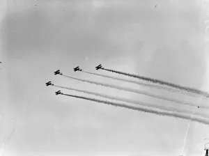 Royal Airforce Bristol Bulldog fighter planes fly in formation during a smoke display