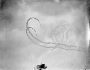 Royal Airforce Bristol Bulldog fighter planes fly in formation during a smoke display