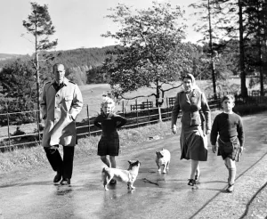 Royal family take a stroll. Queen Elizabeth, the Duke of Edinburgh and their two