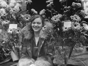 Royal Horticultural Show at Horticultural Hall. Miss Edith Day with Rose Marie