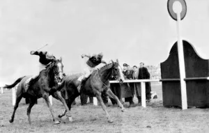 Royal Tan (right) jockey Brian Marshall winning the Grand National Steeplechase