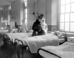 Royal visit to wounded Zeebrugge Heroes in Chatham Naval Hospital. The Queen talking to A