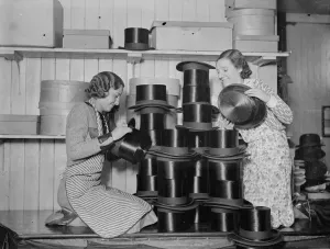 The rush to buy silk hats for the Royal Wedding keeps London factories busy. 5