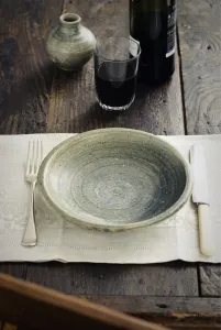 Knife Prints: Rustic table setting with tumbler of red wine before food arrives credit: Marie-Louise