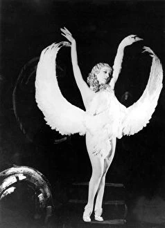 Young Collection: Sally Rand of Fan Dance fame is shown in one of the positions in her new dance which