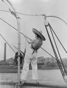 Scenes on board showboat on Thames. Mannequins displaying beach wear