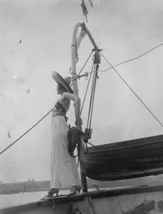 Scenes on board showboat on Thames. Mannequins displaying beach wear