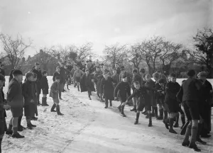 Playing Prints: Schoolboys sliding on the snow in Orpington, Kent. 1937
