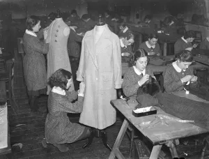 Schoolgirl dressmakers prepare for their own exhibition. Youthful dressmakers, milliners
