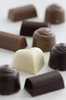 Sweets Prints: A selection of white, dark, and milk chocolates on white surface. credit: Marie-Louise