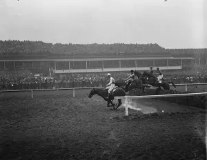 Sensational Grand National. Some of the field taking one of the difficult jumps