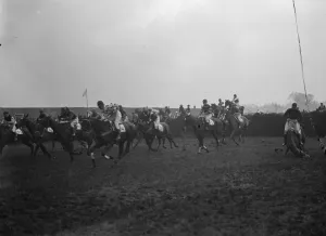 Fence Prints: Sensational Grand National. The scene as the field took the first jump, and showing
