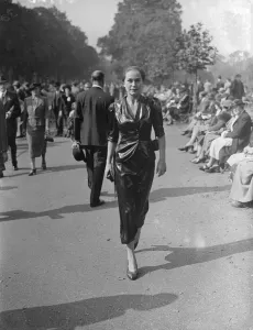 Shining fashion in the Park. Black Cira (waxed silk) fashion scene in the sunny Hyde Park today