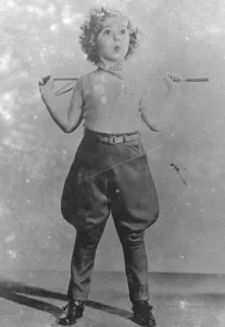 Shirley Temple Goes A - Riding Photo shows : Shirley Temple, the child film actress