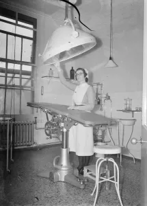 Health Care Prints: The Sidcup Cottage Hospital in Kent. A sister woking in the operating theatre