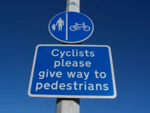 Safety Prints: Sign with blue circle indicating segregated pedal cycle and pedestrian route with