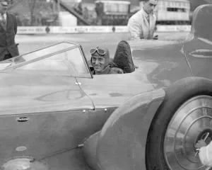 Sir Malcolm Campbell in cockpit of his car Bluebird at Brooklands track Easter Monday