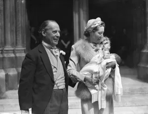 Sir William and Lady Garthwaite and their baby after the christening at St James