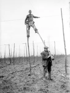Memory Lane Prints: Skilled men walked the hopfields on huge stilts to string the hop poles Kent 1937