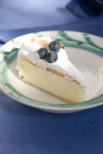 Outdoors Prints: Slice of celebration gateau of light lemon and passionfruit mousse with soft meringue