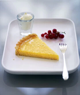 Raspberry Collection: Slice of classic lemon tart served with fresh redcurrants, lemon zest and creme fraiche credit