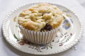 Small currant muffin topped with grated apple credit: Marie-Louise Avery / thePictureKitchen