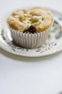 Small currant muffin topped with grated apple credit: Marie-Louise Avery / thePictureKitchen