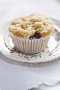 Small currant muffin topped with grated apple credit: Marie-Louise Avery / thePictureKitchen