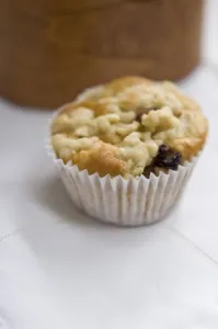 Small currant muffin topped with grated apple credit: Marie-Louise Avery / thePictureKitchen