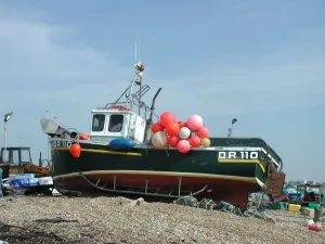 Shingle Prints: Small fishing boat with colourful buoys and lobster-pots, Walmer beach, Kent, England