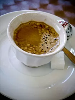 Caffeine Collection: Small handleless cup of strong Turkish coffee on cafe table credit: Marie-Louise