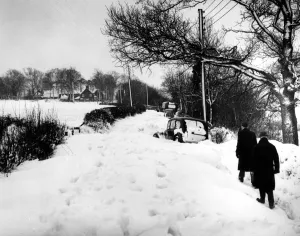 People Prints: Snow drifts in Kent rendered some three buses and five cars and lorries useless over