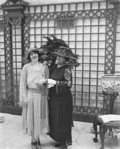 Society garden party at Lady Hultons residence. Lady Huton ( left ) and Lady