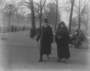 Society in the park Sir George and Lady Lewis taking a stroll in the Row London