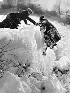 Southern England under snow a pedestrian rescued from a dangerous predicament near