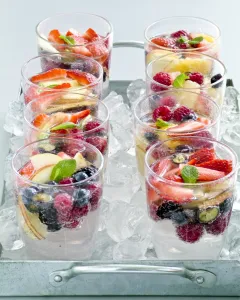 Healthy Prints: Sparkling water with fresh fruit and berries in glasses sittin gon crushed ice