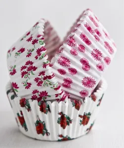 Kitchen Prints: Stack of decorative flowery paper cake and muffin cases credit: Marie-Louise Avery