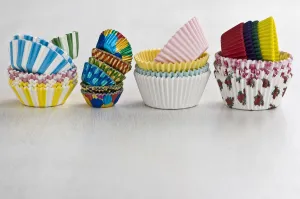 Stacks of decorative paper and foil cake and muffin cases credit: Marie-Louise