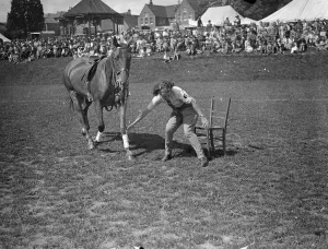 Staking Her Claim ! Photo Shows : Leading her poney, a girl rider eagerly lays