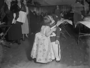 A stolen kiss by two toddlers at the NSPCC ( National Society for the Prevention