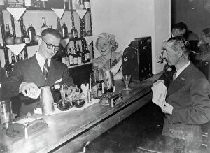 Press Photography Collection: Stravinskys secretary now runs cocktail bar with London dancer as hostess. Gilbert Ramognie