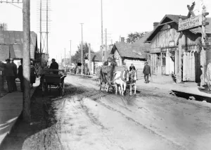 A street scene in Barowslav, showing the street six inches deep in oily liquid draining
