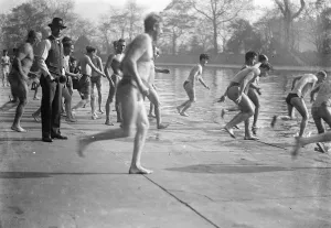 Outside Prints: Sunbathers rushing to dive into the water. 1933