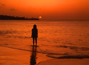 Paradise Prints: Sunset - girl on tropical island beach