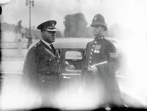 Superintendent curry and Sgt backshall leave Buckingham Palace. The two police officers
