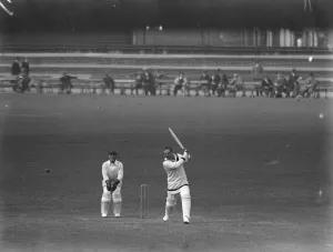 Surrey versus Hampshire at the Oval. The Hon L H Tennyson making a drive in