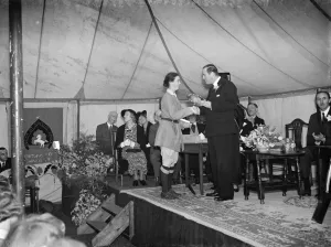 The Swanley horticultural college speech day. Earl of Feversham presents a plate