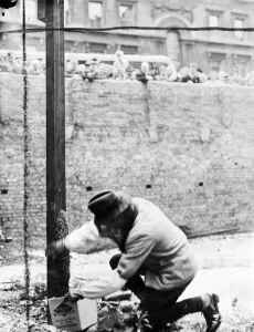 1940s Prints: A swarm of bees which settled at the foot of a pole on a bomb site in Victoria Street